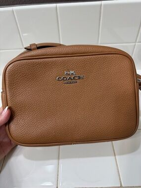 Coach Pebbled Leather crossbody Bag in Tan Brown with silver